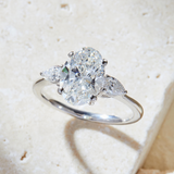 Oval Shape Lab Grown Diamond Engagement Ring with Side Pear Shape Stones